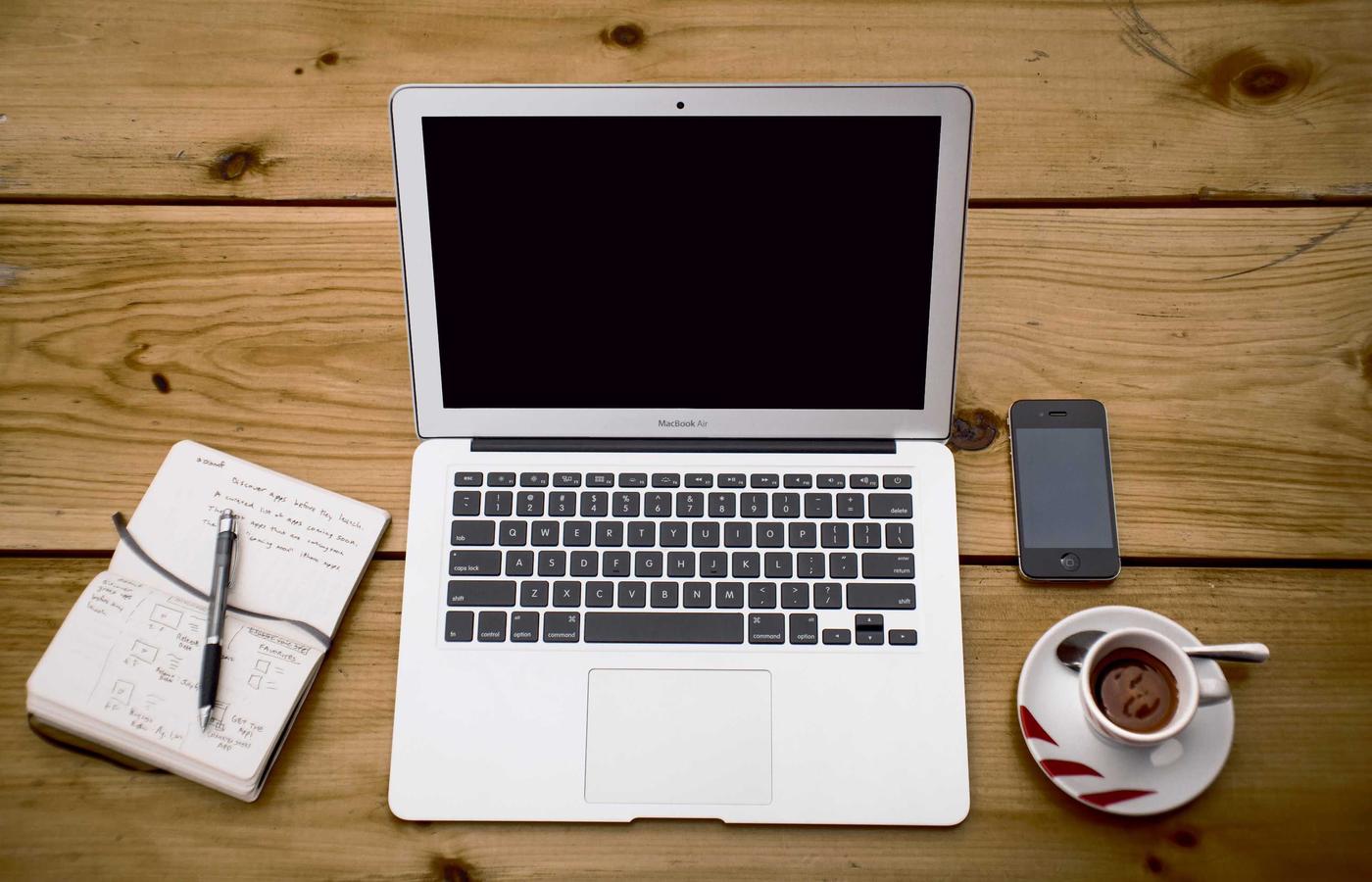 Editor at the reading room table with folio and pencil